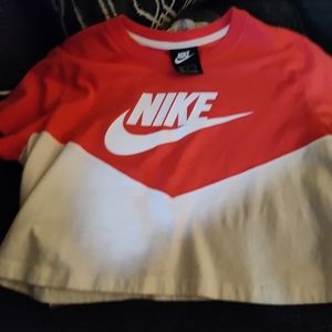 Orange and white had shirt and leggings. The shirt